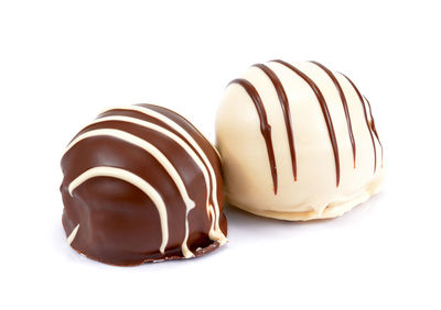 Close-up of chocolate cake against white background