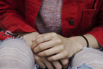 Midsection of couple wearing ring