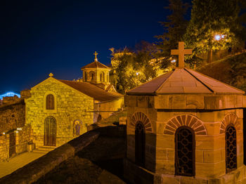 Illuminated building against sky at night