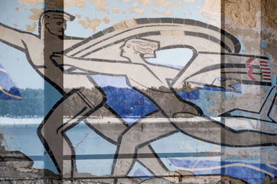 Close-up of graffiti on wall of building