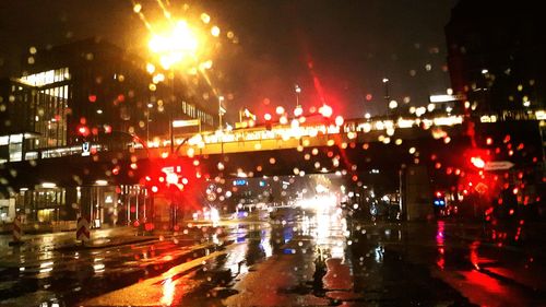 Illuminated city street at night