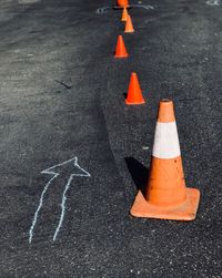 High angle view of arrow sign on road in city