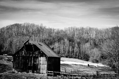 Panoramic view of barn against sky