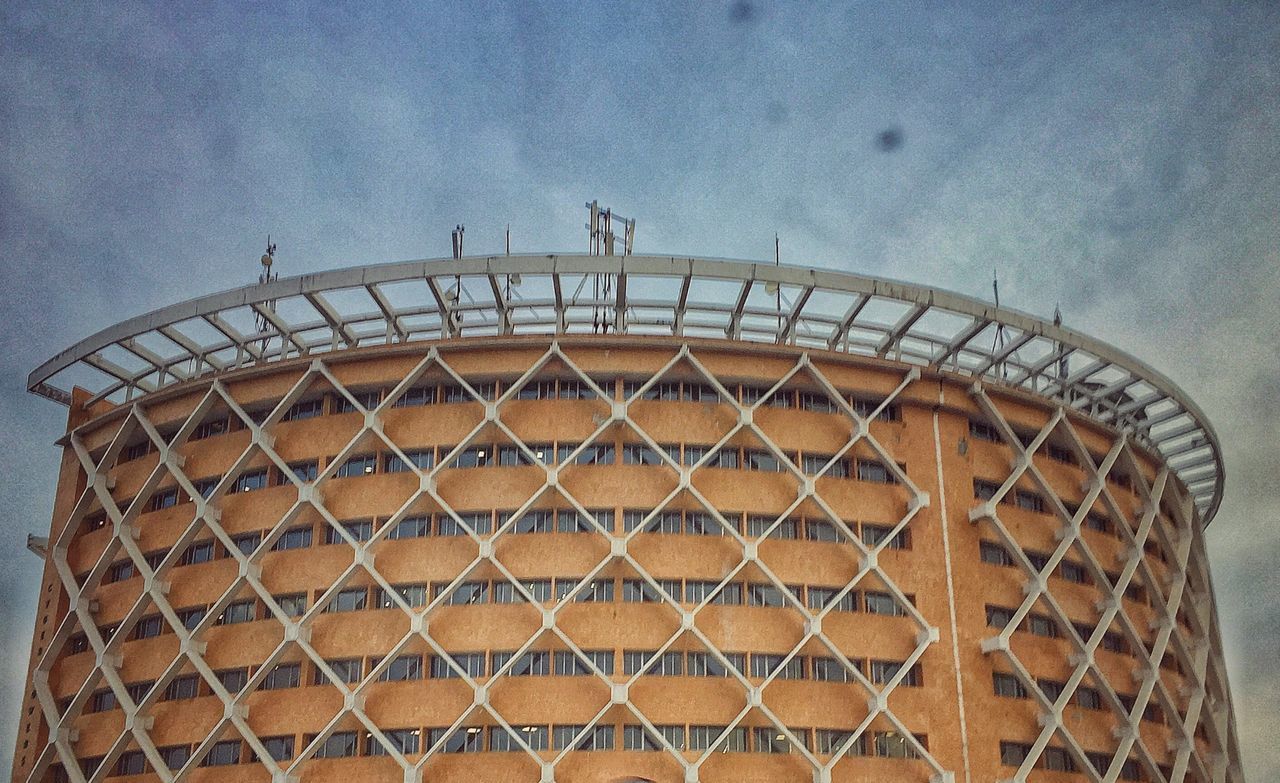 LOW ANGLE VIEW OF BUILT STRUCTURES AGAINST SKY