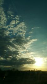 Scenic view of landscape against sky at sunset