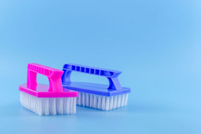 Close-up of blue colored pencils over white background