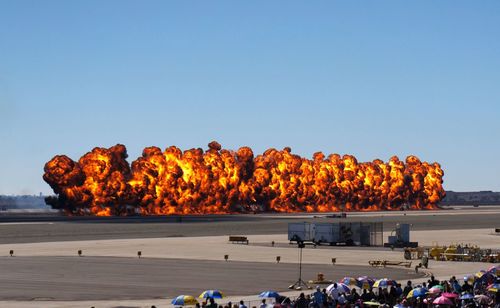 Group of people on land against clear sky