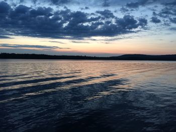 Scenic view of lake against cloudy sky