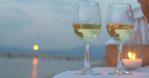 Close-up of wine glasses on table