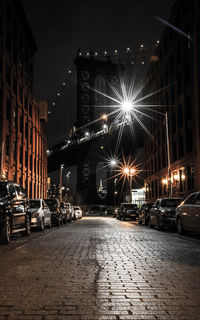 Illuminated city street at night