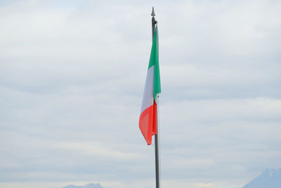 Italian flag on a pole.