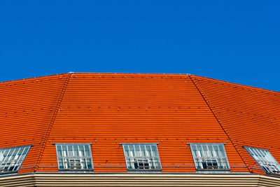 Low angle view of building against clear blue sky