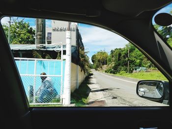 Road seen through car window