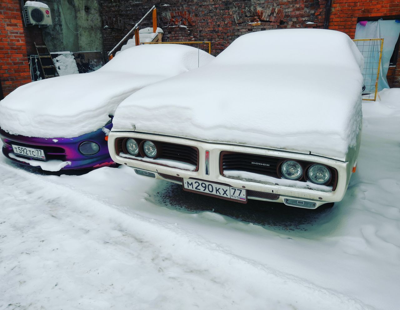 SNOW COVERED CAR ON STREET