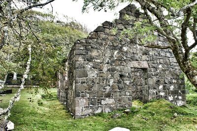 Old built structure with trees in background