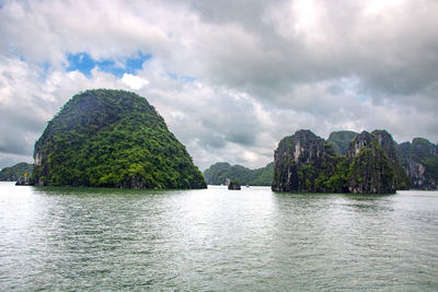 Panoramic view of sea and mountains against sky