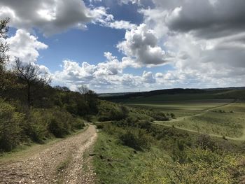 Road amidst landscape against sky