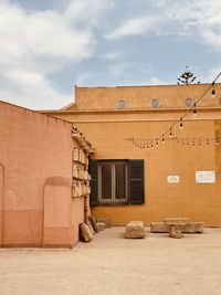 Built historic structures against sky with lights