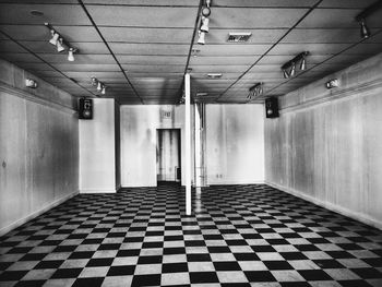 Empty corridor along buildings