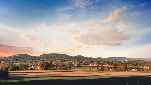 Scenic view of landscape against sky during sunset