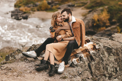 Young couple on rock