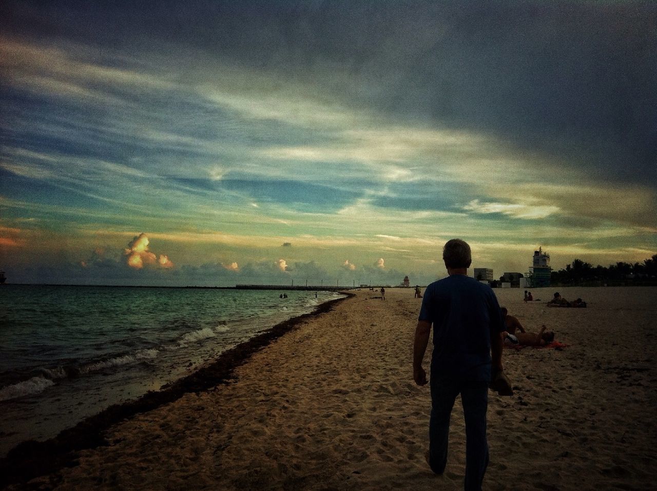 rear view, sea, beach, full length, water, lifestyles, shore, leisure activity, sky, horizon over water, standing, men, sunset, tranquil scene, scenics, beauty in nature, tranquility, walking