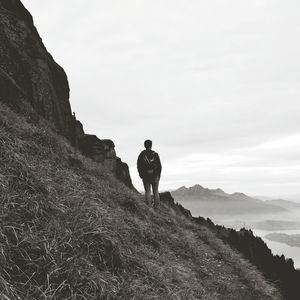 Full length of woman standing on rock