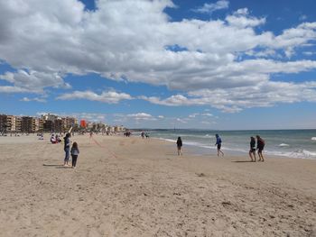 People playing at beach