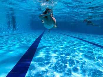 Girl swimming in pool