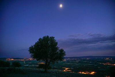 Scenic view of landscape against sky at dusk