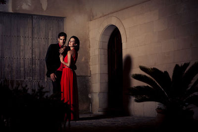 Young couple standing in red building