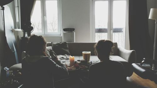 Man looking through window