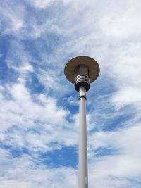 Low angle view of communications tower against sky