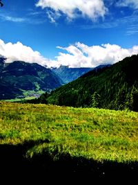 Scenic view of mountains against cloudy sky