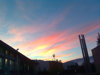 Low angle view of building against sky at sunset