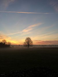 Scenic view of landscape against sky at sunset