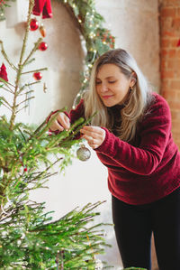 Young woman with christmas tree