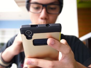 Teenage boy using mobile phone