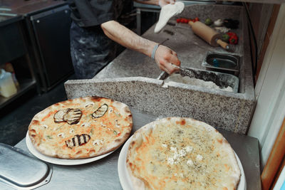 Cropped hand of person preparing food