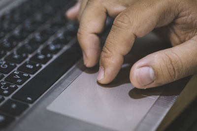 Midsection of person using mobile phone