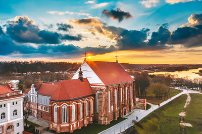 High angle view of buildings in city against sky during sunset