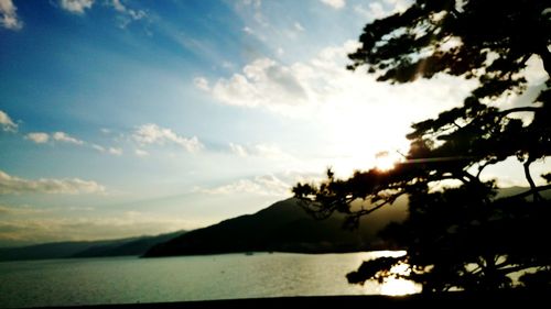 Scenic view of lake against cloudy sky