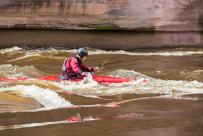 Full length of man in river