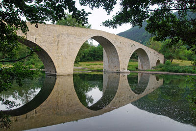 Bridge over river against sky