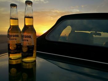 View of bottle against sky during sunset