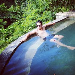 High angle view of young man in water