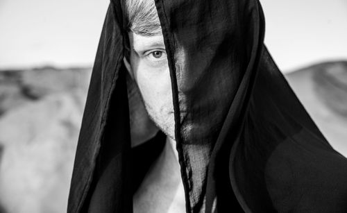 Portrait of man wearing scarf outdoors