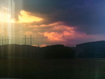 Silhouette of built structure at sunset