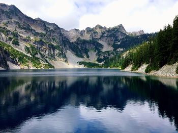 Scenic view of lake with mountains in background