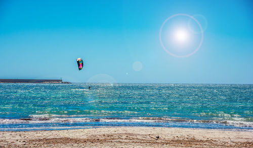 Scenic view of sea against clear blue sky